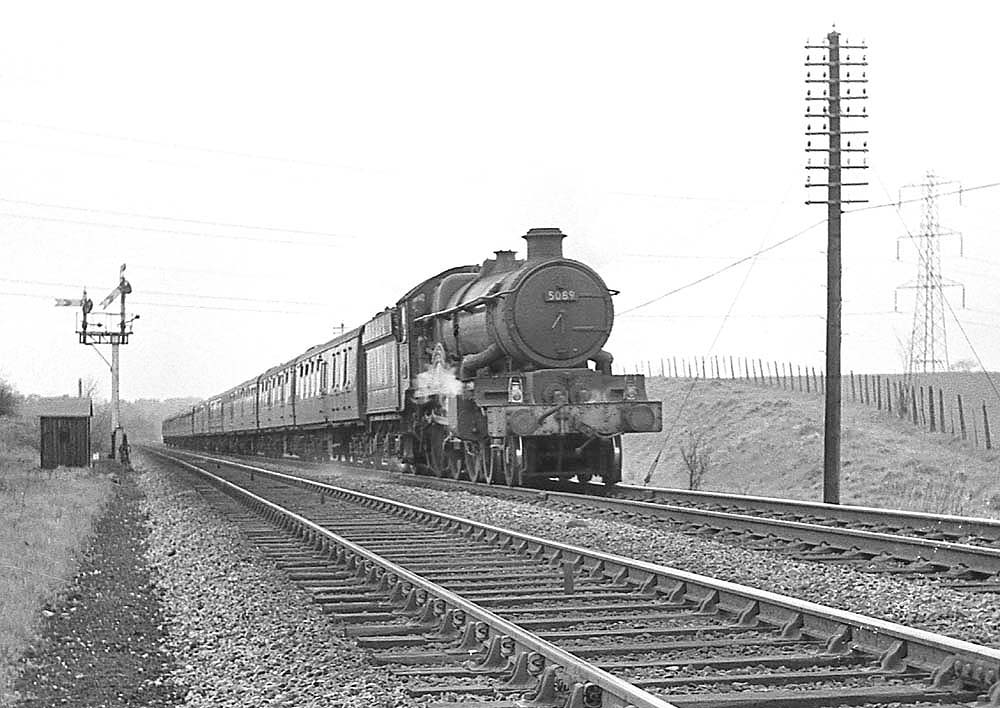 Ex-GWR 4-6-0 Castle Class No 5089 'Westminster Abbey' works an up train near Lapworth on 27th April 1963