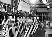 A nighttime interior view of Lapworth Signal Box showing the lever frame and instrument below the display panel circa 1956
