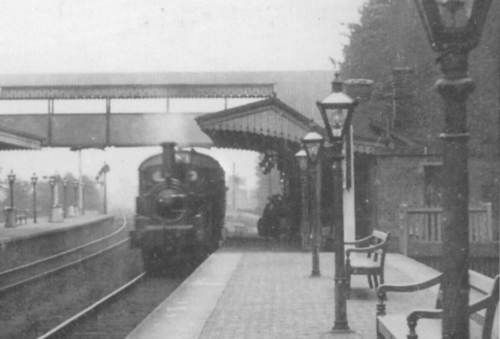 Close up of the GWR 517 class at the head of a down Autotrain and the ornate timber bench seating and the buffer beam of the down bay