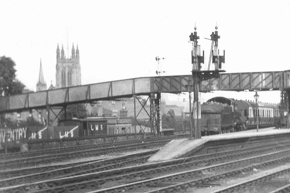 Close up showing a GWR 2-6-0 43xx class with two slip coaches to be attached to a Paddington train