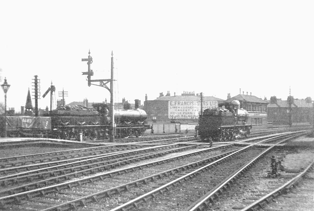 View looking towards London and the South Signal Box an unidentified GWR 0-6-0 'Standard Goods' passes the up goods signal
