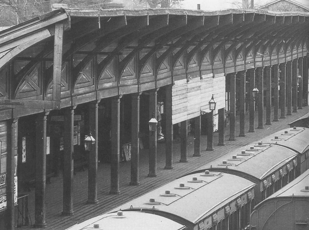 Close up showing the central portion of the up platform and the ad-hoc timber windscreen erected on the columns