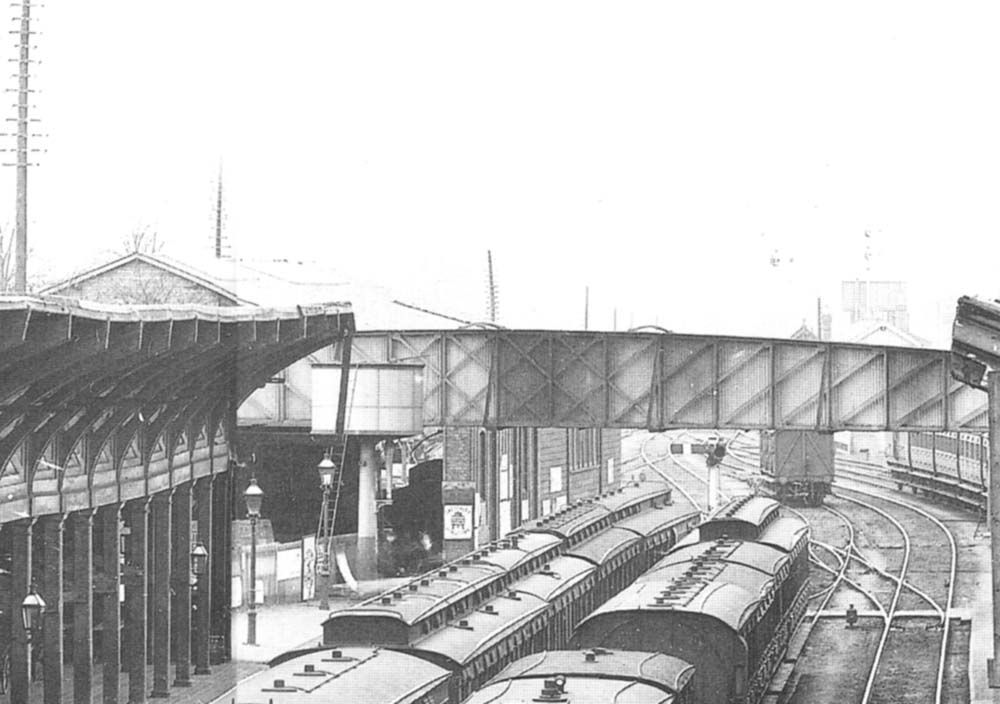 Close up showing the Birmingham end of the down platform including the water column and goods shed