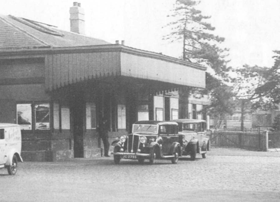 Close up showing the short canopy which projected out above the entrance to the booking office and the down platform