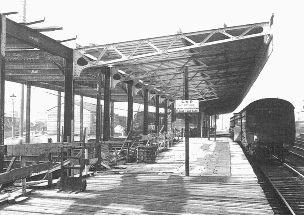 Close up showing a temporary wooden platform bridging the gap to join with the late 19th century extension