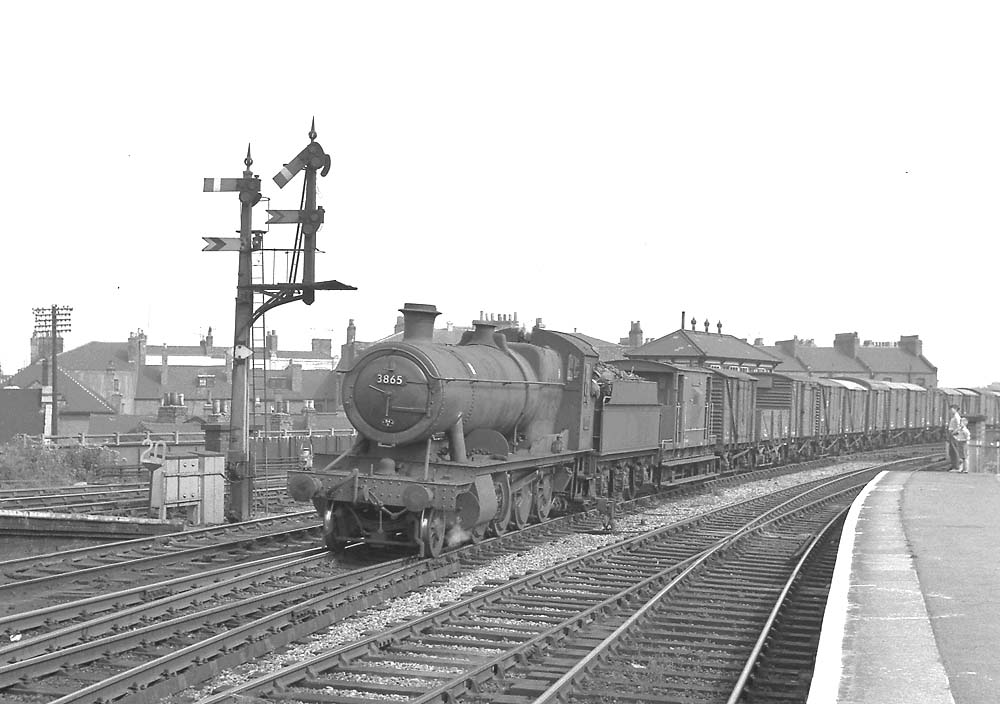 Ex-GWR 2-8-0 No 3865 is seen at the head of a down freight passing through Leamington's centre road