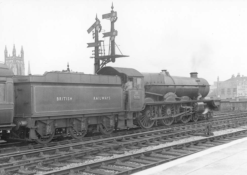 Ex-GWR 4-6-0 King class No 6001 'King Edward II' pauses at the end of the up platform at the head of a Paddington express