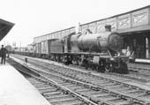 GWR 2-8-0 No 2858 passes through Leamington station on the middle road whilst at the head of an up frieght