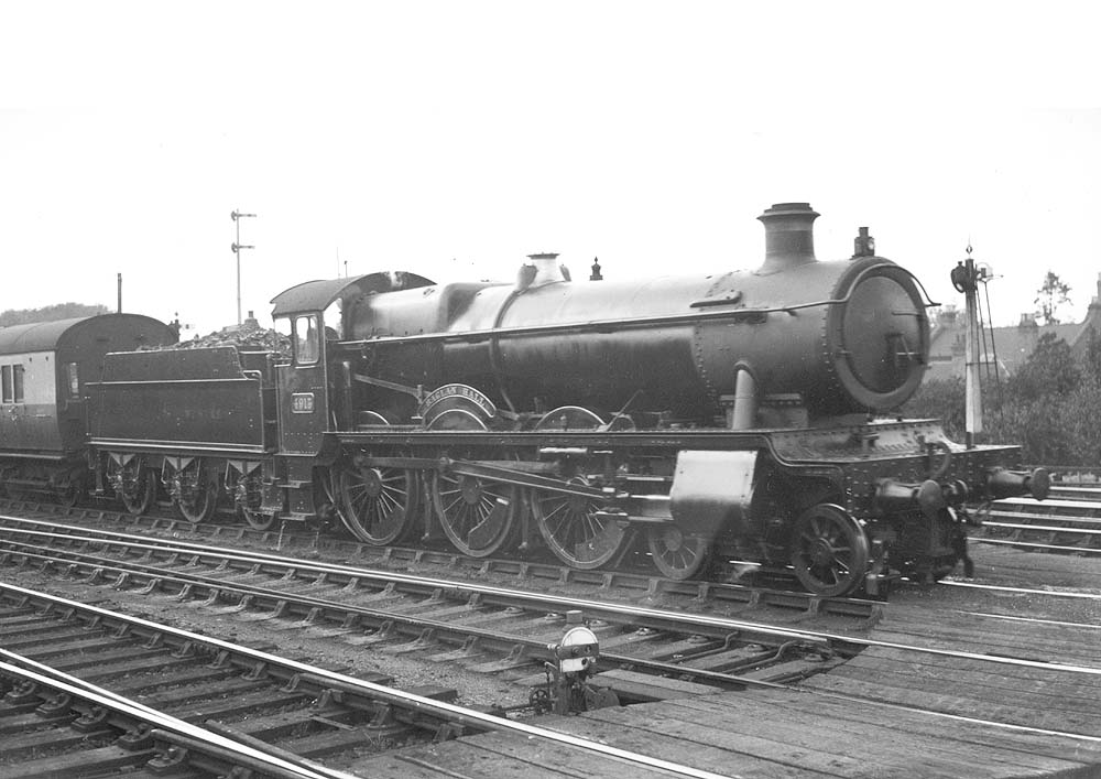 Great Western Railway 4-6-0 No 4913 'Baglan Hall' is seen standing at the head of an up express service