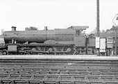 GWR 4-6-0 No 6831 'Bearley Grange' is seen passing behind the station on the goods loop circa 1938