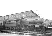 GWR 4-4-0 No 3815 'County of Hants' stands at the head of an up local passenger service