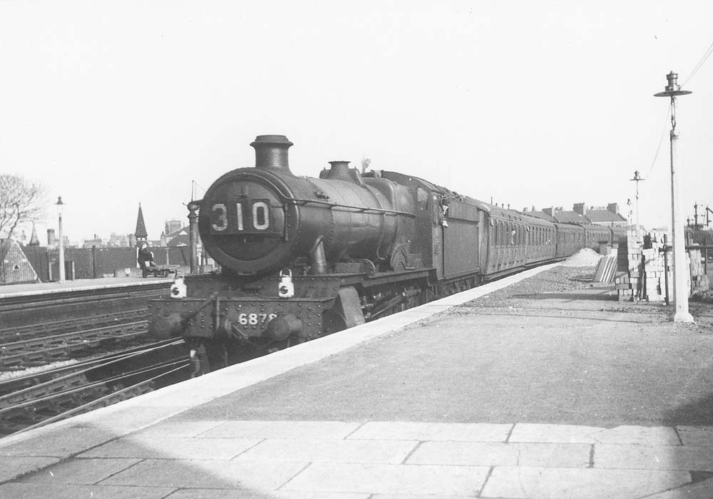 GWR 4-6-0 No 6878 'Longford Grange' coasts into the down platform with an express in October 1947