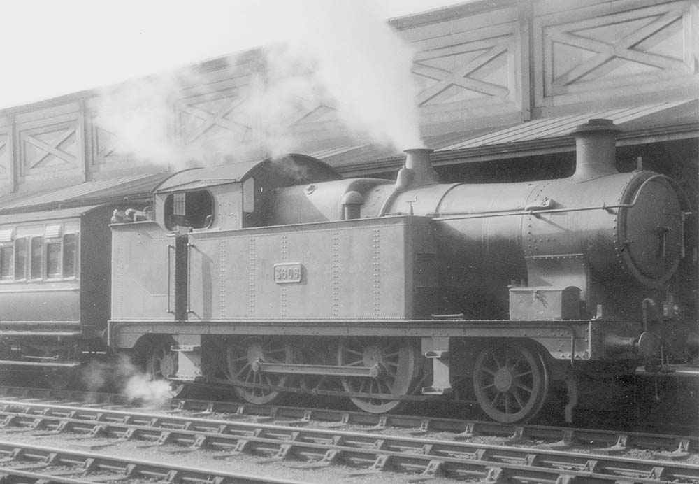 GWR 36XX class 2-4-2T No 3606 arrives at the up platform at the head of an up local passenger train circa 1928