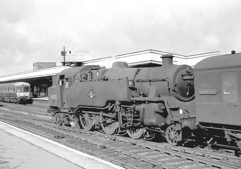 British Railways 2-6-4T No 80072 crosses from the through line to the platform line with a down local parcels train on 28th September 1963