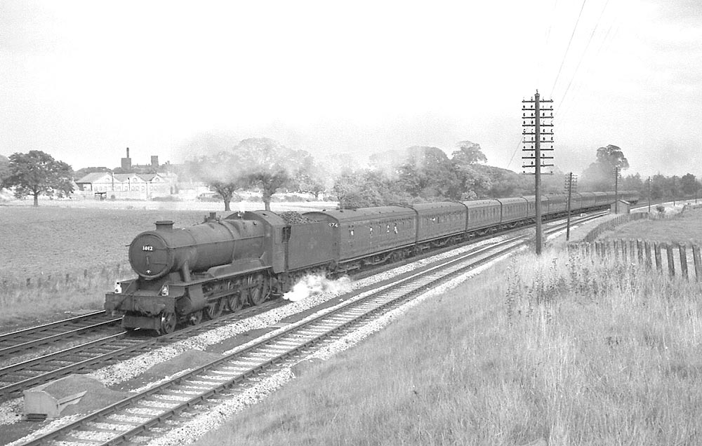 Ex-GWR 4-6-0 No 1012 'County of Denbeigh' is seen on a Wolverhampton service on 28th September 1963