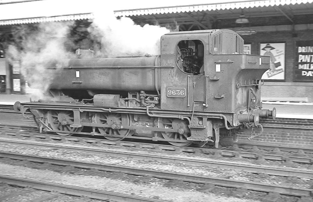 Ex-GWR 57xx Class 0-6-0PT No 9636 blows off steam when paused at Leamington station on 5th October 1963
