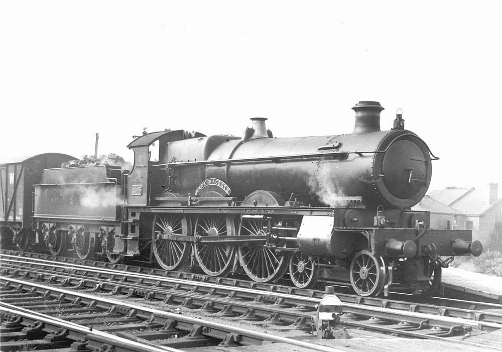 GWR 4-6-0 29xx ‘Saint’ class No 2905 'Lady Macbeth' stands at the up platform with an up goods train