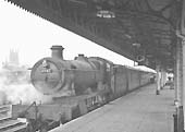 Ex-GWR 49xx Class 4-6-0 No 6947 'Helmingham Hall' stands at Leamington's down platform on 16th February 1957