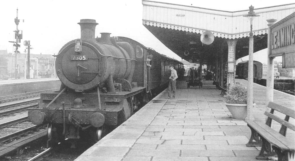 Ex-GWR 43xx Class 2-6-0 No 7305 pauses with a local passenger service at Leamington's down platform in August 1960