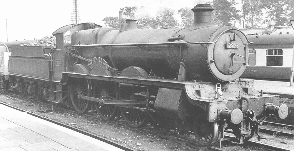 Ex-GWR 2902 Class 4-6-0 No 2933 'Bilbury Court' is seen standing in the road behind the down bay line on 6th September 1952