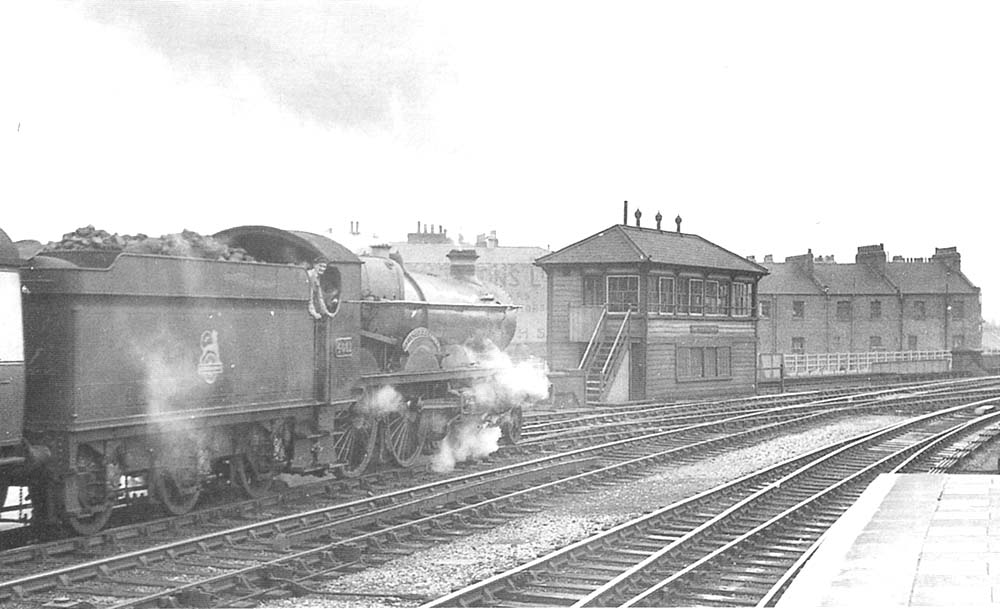 Ex-GWR 40xx Class 4-6-0 No 4021 'British Monarch' stands at Leamington's up platform with an up express circa 1952