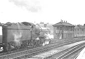 Ex-GWR 40xx Class 4-6-0 No 4021 'British Monarch' stands at Leamington's up platform with an up express circa 1952
