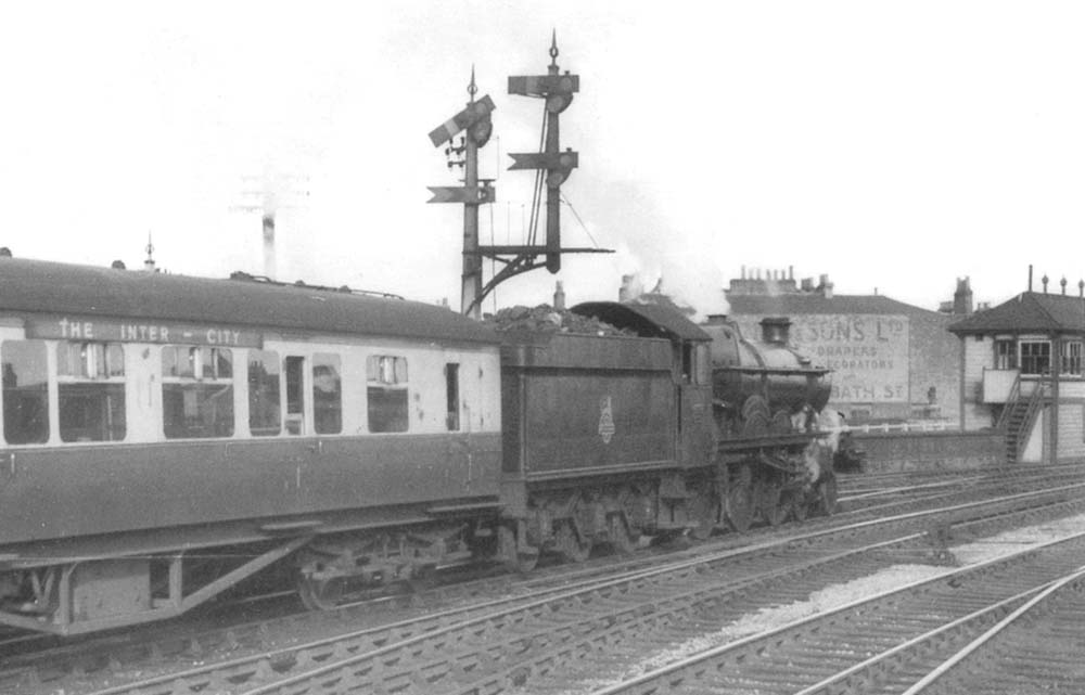 An unidentified ex-GWR 4-6-0 Castle Class locomotive approaches Leamington South Signal Box on a Wolverhampton to Paddington service circa 1952