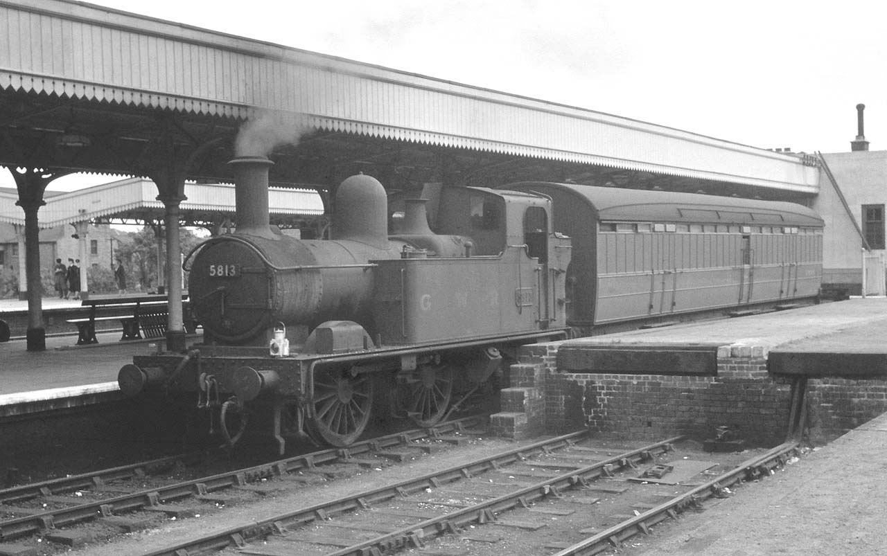 Ex-GWR 0-4-2T No 5813 stands in Leamington's down bay platform with a Gresley Full Brake on  31st August 1957