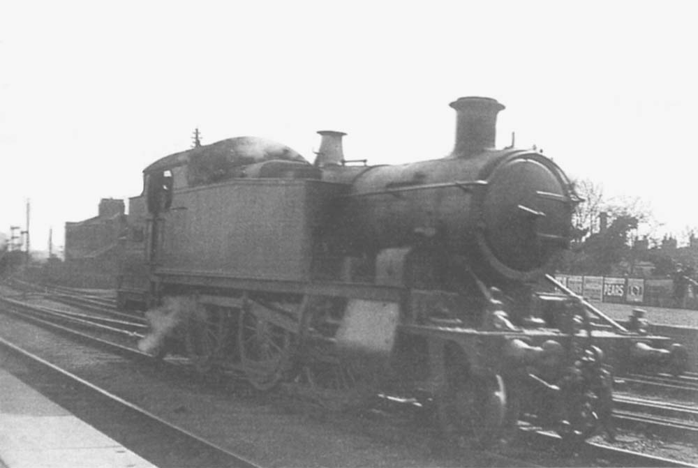 An unknown GWR 31xx 2-6-2T stands in one of the middle sidings  at Leamington station