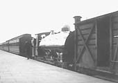 An unidentified GWR 0-6-0ST  stands in the up bay  in front of a rake of local coaching stock