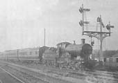 An unidentified GWR 4-4-0 is seen working the 9.30am Birkenhead to Bournemouth train formed of LSWR stock