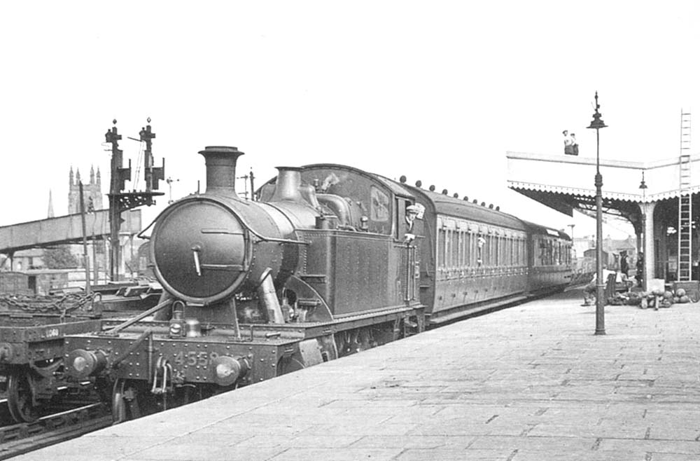 GWR 2-6-2T  No 4558 stands in the up platform bay with two through coaches from Stratford