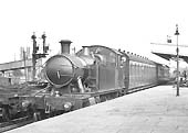 GWR 2-6-2T  No 4558 stands in the up platform bay with two through coaches from Stratford