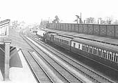 An unknown GWR 4-6-0 Star class locomotive stands at the London end of an express train on the down platform