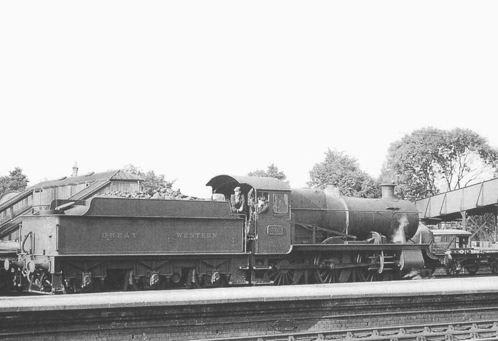 GWR 2-6-0 Mogul No 9308 runs light engine on the goods loop at the rear of the station circa 1936
