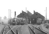 A solitary 0-6-0 Diesel shunter stands on the right hand road alongside a number of ex-GWR locomotives on 27th April 1961