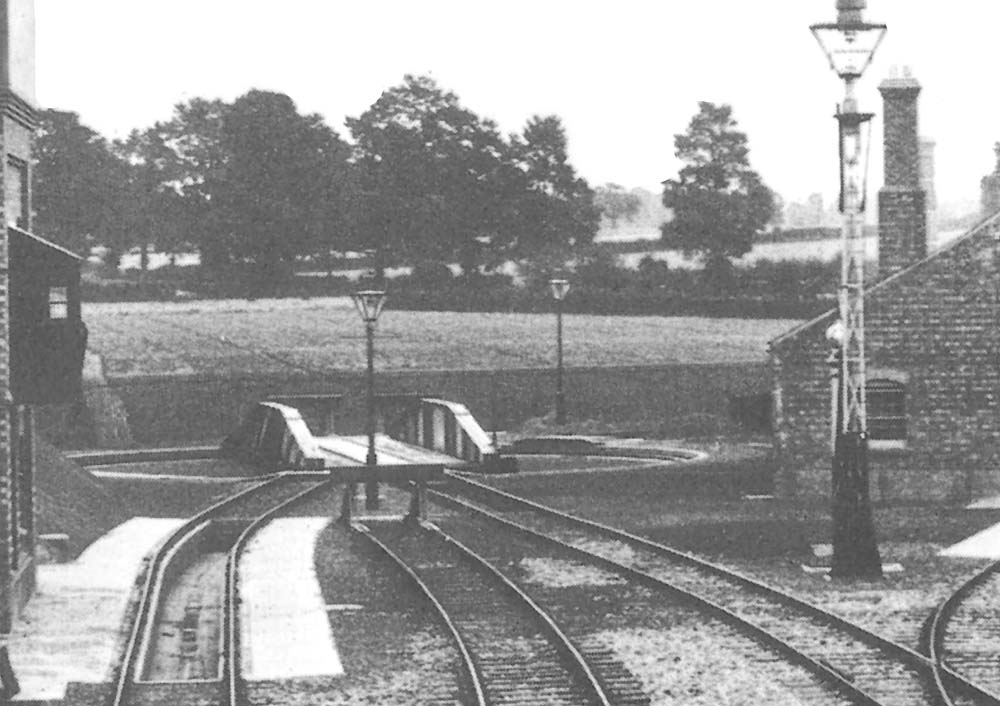 Close up showing the 65 ft over-girder turntable with three buffer stops including on the right the siding to the sand furnace