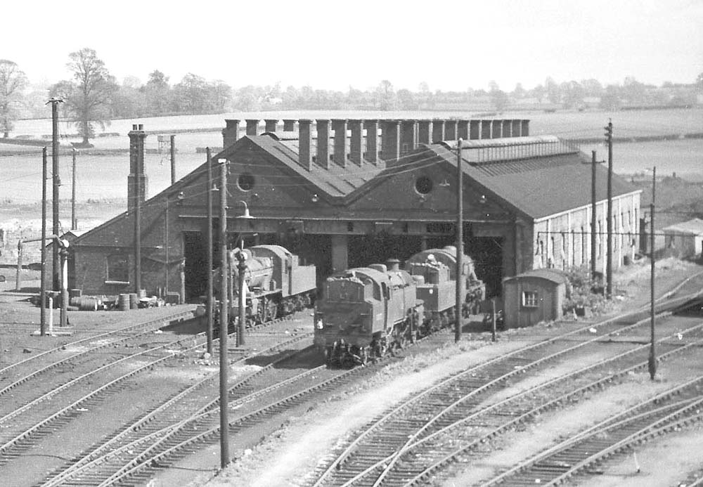 Close up of the shed showing two ex-LMS 2-6-0 and one BR Standard 2-6-4T locomotives stabled outside just a few weeks prior to closure in 1965