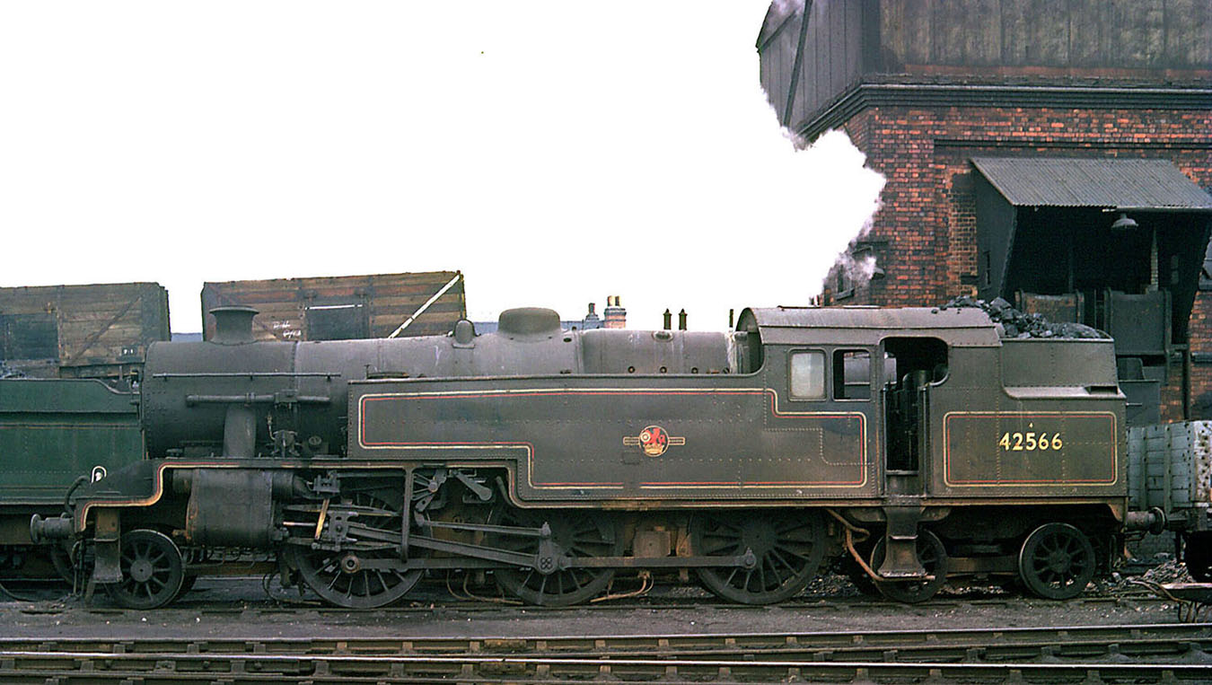 Ex-LMS 2-6-4T No 42566, is standing in front of Leamington shed's coaling stage in March 1962