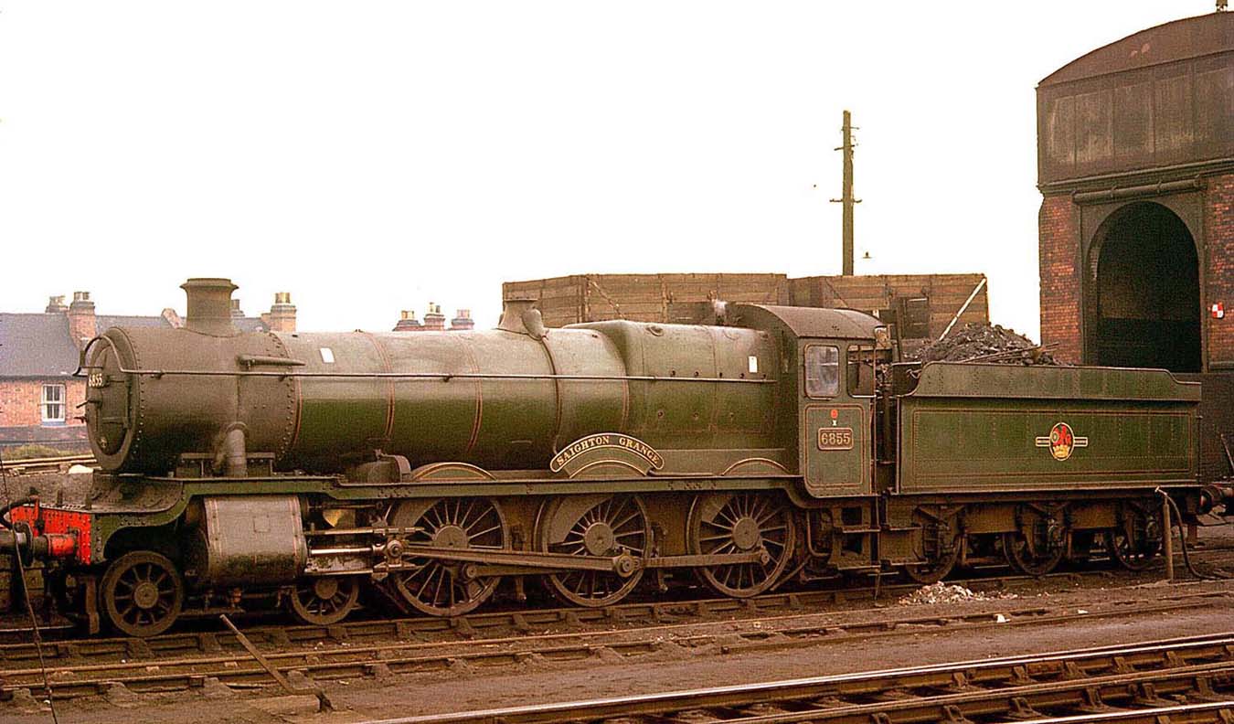 Ex-GWR 4-6-0 No 6855 'Saighton Grange' is standing below the coal stage at Leamington shed in March 1962