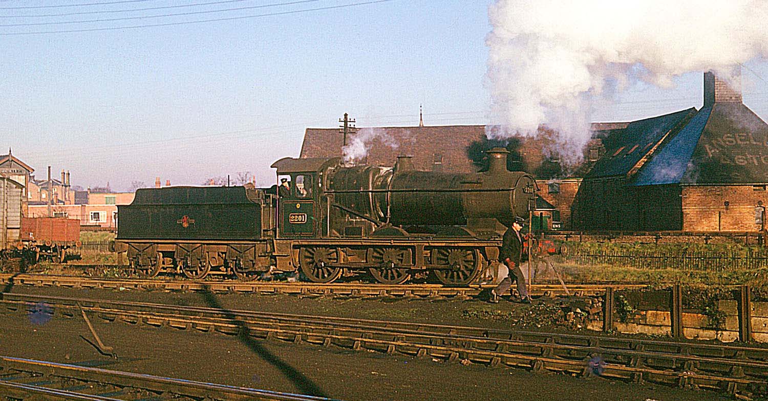 Ex-GWR 0-6-0 No 2201 is shunting wagons on the coal stage roads at Leamington shed in December 1961