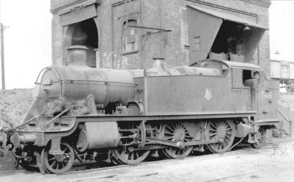 Ex-GWR 2-6-2T Prairie No 4112 stands under the coaling stage with its enlarged coal tipping mechanism