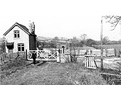 A 1950s view looking towards the goods yard with the branch to Moreton-in-Marsh curving to the left beyond the level crossing gates