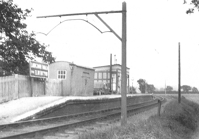 Looking east towards Shipston-on-Stour with the corrugated parcel shed standing next to the station name board