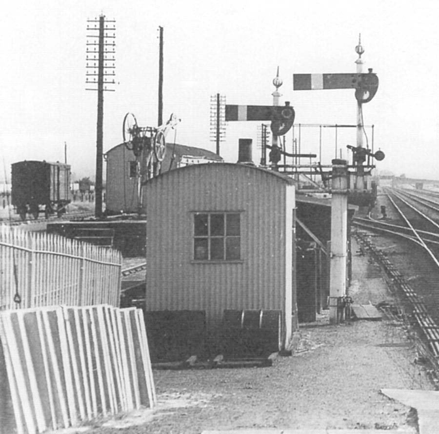 Close up showing some of the goods yard including the fixed yard crane mounted on the landing dock which has a grounded coach body in lieu of a goods shed
