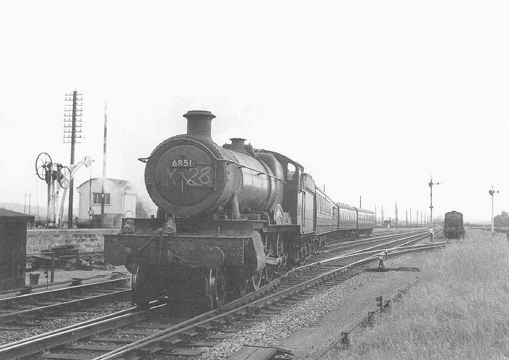 Ex-GWR 4-6-0 68xx Class No 6851 'Hurst Grange' departs from Long Marston sidings with an up empty stock working circa 1960