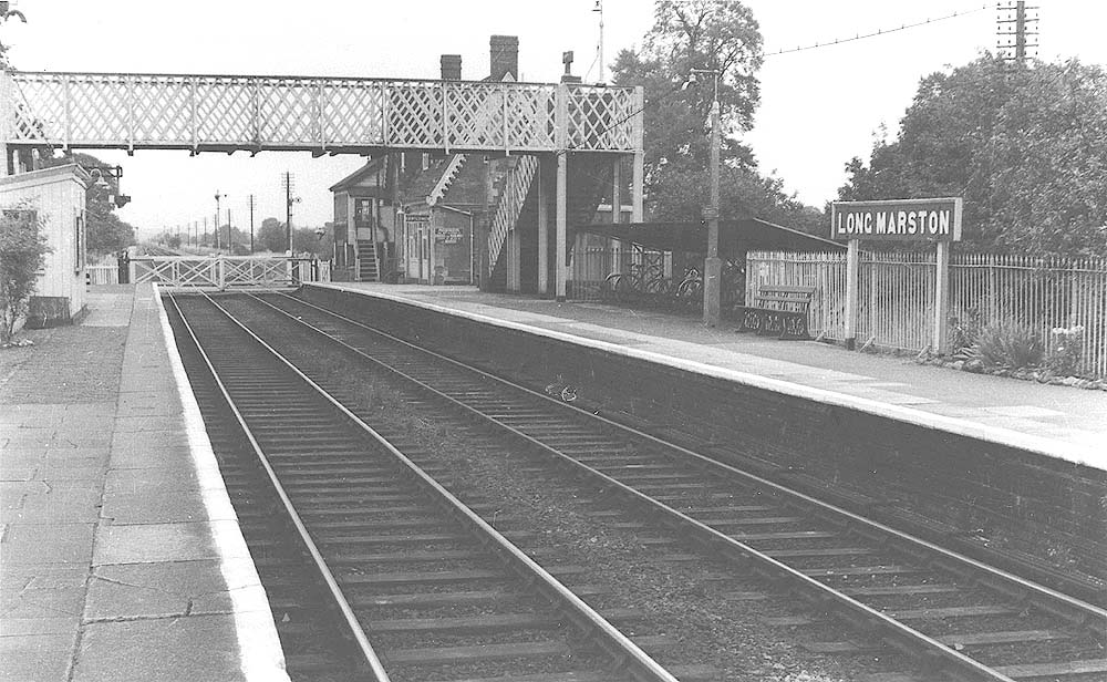 A later view of Long Marston station looking towards Stratford upon Avon now with a passenger footbridge and cycle shed