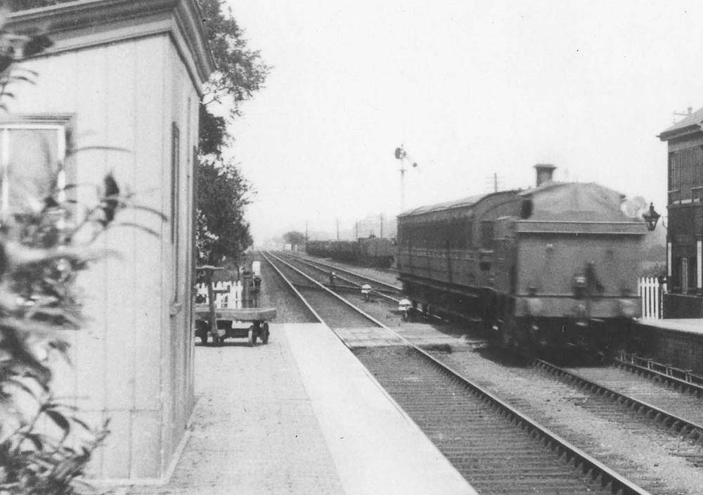 Close up showing the GWR 517 or 3571 class locomotive with a sheet fixed to cover the bunker to prevent ingress of coal dust when running bunker first