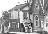 Close up showing the most obvious visual change to the station, the steps of the signal box being moved nearer to the line