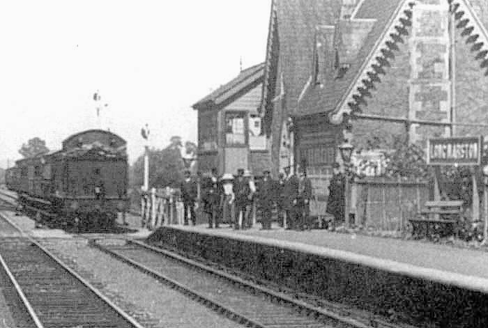 Close up showing another GWR 2-6-2T class 31xx locomotive entering the station with a four-coach local passenger service
